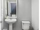 This half bathroom features a pedestal sink and neutral wall color at 4260 E Warren Ave # 5, Denver, CO 80222