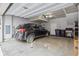 Spacious garage with epoxy floors, ample storage, and modern car at 4260 E Warren Ave # 5, Denver, CO 80222
