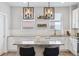 Bright kitchen featuring granite countertops and modern light fixtures over the island at 4260 E Warren Ave # 5, Denver, CO 80222