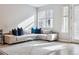 Bright living room with a comfortable sectional sofa and a modern geometric rug at 4260 E Warren Ave # 5, Denver, CO 80222