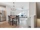 Inviting living area featuring a dining table, stainless steel refrigerator, and living room at 4260 E Warren Ave # 5, Denver, CO 80222