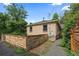 Cozy backyard with brick exterior and a charming wooden fence at 1540 Filbert Ct, Denver, CO 80220