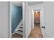 Basement stairway leading to finished space with new flooring at 1540 Filbert Ct, Denver, CO 80220