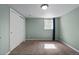 Bedroom features carpet floors, light-green walls and a closet with sliding doors at 1540 Filbert Ct, Denver, CO 80220