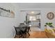 Charming dining area featuring hardwood floors with stylish table near bright kitchen at 1540 Filbert Ct, Denver, CO 80220