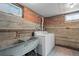 Basement laundry room with a large sink and washer and dryer hookups at 1540 Filbert Ct, Denver, CO 80220