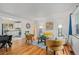 Bright living room featuring hardwood floors and stylish decor, with views to the kitchen at 1540 Filbert Ct, Denver, CO 80220
