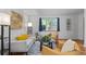 Stylish living room with hardwood floors, comfortable seating, and natural light from a window at 1540 Filbert Ct, Denver, CO 80220
