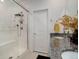 Bathroom with a modern tiled shower, and a vanity with granite countertop at 23670 E 41St Ave, Aurora, CO 80019