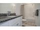 Bathroom featuring a vanity with granite countertop, tiled shower and tub with neutral decor at 23670 E 41St Ave, Aurora, CO 80019