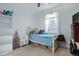 Cozy bedroom with a single bed, natural light, and carpeted flooring at 23670 E 41St Ave, Aurora, CO 80019