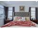 Comfortable bedroom features a luxurious bed and large windows at 23670 E 41St Ave, Aurora, CO 80019