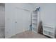 Bedroom featuring a sliding closet, a bookshelf, and neutral carpet at 23670 E 41St Ave, Aurora, CO 80019