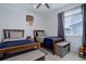 Bright bedroom featuring two twin beds, ceiling fan, a window, and modern decor at 23670 E 41St Ave, Aurora, CO 80019