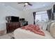 Spacious bedroom with elegant furniture, large windows, and ample lighting at 23670 E 41St Ave, Aurora, CO 80019