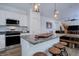 Kitchen featuring granite countertops, pendant lighting, stainless appliances, and wooden barstool seating at 23670 E 41St Ave, Aurora, CO 80019