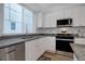 Kitchen featuring stainless steel appliances, granite countertops, and lots of bright, natural light at 23670 E 41St Ave, Aurora, CO 80019