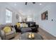 Cozy living area with dark sofa, modern furniture and artwork at 23670 E 41St Ave, Aurora, CO 80019