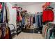 Walk-in closet with built in shelving, hanging racks, and carpeted flooring at 23670 E 41St Ave, Aurora, CO 80019
