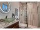 Modern bathroom with glass shower, updated vanity, and granite countertop at 291 S Franklin St, Denver, CO 80209