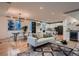 Open concept dining area with hardwood floors and modern chandelier at 291 S Franklin St, Denver, CO 80209