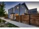 Modern two-story home with stone and gray siding, plus a landscaped front yard at 291 S Franklin St, Denver, CO 80209