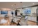 Modern kitchen with white cabinets, granite island, and stainless steel appliances at 291 S Franklin St, Denver, CO 80209