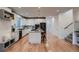 Modern kitchen with white cabinets, a large island, and stainless steel appliances at 291 S Franklin St, Denver, CO 80209