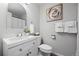 Bright bathroom features a white vanity, modern fixtures, and decorative accents at 4633 S Crystal Way # E189, Aurora, CO 80015