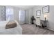 Bedroom featuring carpet, large windows, desk and decor at 4633 S Crystal Way # E189, Aurora, CO 80015