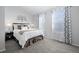 Bedroom featuring carpet, large windows, and modern decor at 4633 S Crystal Way # E189, Aurora, CO 80015