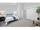 Bright bedroom with a sloped ceiling, neutral tones, and plush carpeting at 4633 S Crystal Way # E189, Aurora, CO 80015