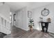 Neutral hallway with gray wood floors, stairs, and utility closet with washer/dryer at 4633 S Crystal Way # E189, Aurora, CO 80015