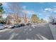 Street view of townhomes with parking and many trees at 4633 S Crystal Way # E189, Aurora, CO 80015