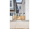 New townhome facade with gray and white siding complemented by a modern wood fence at 5363 W 14Th Ave, Lakewood, CO 80214