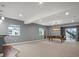 The spacious basement features a pool table, stylish lighting, and outdoor access to the backyard at 2351 Lassen Ln, Castle Rock, CO 80109