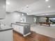 The basement features a bar with seating and a billiards room with a custom light fixture and a pool table at 2351 Lassen Ln, Castle Rock, CO 80109