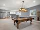 Basement game area featuring a pool table with custom light fixture at 2351 Lassen Ln, Castle Rock, CO 80109