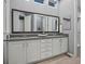 The primary bathroom features double sinks and vanity with granite counters and ample storage space at 2351 Lassen Ln, Castle Rock, CO 80109