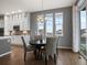 Charming dining area featuring a chandelier, modern decor, and lots of natural light at 2351 Lassen Ln, Castle Rock, CO 80109