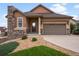 Well maintained home with beautiful stone details, complemented by lush landscaping and a two-car garage at 2351 Lassen Ln, Castle Rock, CO 80109