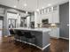 Modern kitchen with island, stainless steel appliances, and plenty of cabinet space at 2351 Lassen Ln, Castle Rock, CO 80109
