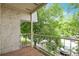 Balcony overlooking a green, tree-lined street and neighborhood at 5770 E Warren Ave # 206, Denver, CO 80222