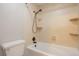 Bathroom featuring a shower and bathtub combo with tile surround at 5770 E Warren Ave # 206, Denver, CO 80222