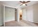 Bedroom featuring a closet, fan and access to a bathroom at 5770 E Warren Ave # 206, Denver, CO 80222