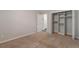 Bedroom featuring a closet and access to other rooms at 5770 E Warren Ave # 206, Denver, CO 80222