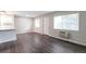 Bright and airy room with wood floors, white trim, and a large window at 5770 E Warren Ave # 206, Denver, CO 80222