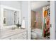 Fresh, updated bathroom with a white vanity and shower/tub combo at 2 Adams St # 905, Denver, CO 80206