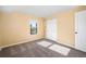 Bright bedroom features natural light, closet, and neutral-toned carpet at 2 Adams St # 905, Denver, CO 80206