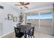 A dining area with patio doors leading to a balcony with views of the surrounding landscape at 2 Adams St # 905, Denver, CO 80206